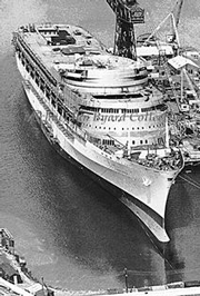 Canberra in the fitting-out basin at Harland and Wolff